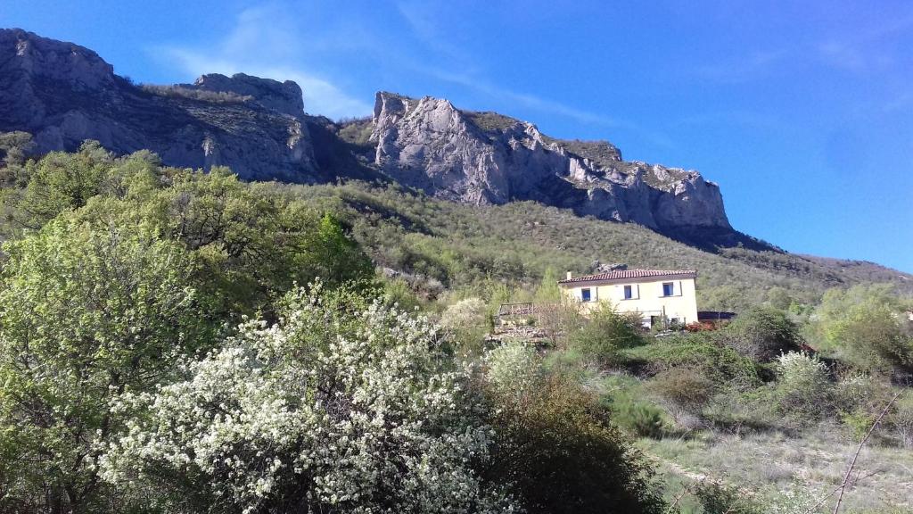 a house on the side of a mountain at Les Terrasses du Paradis in Orpierre