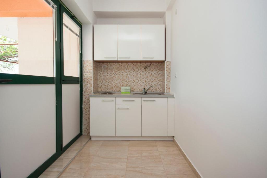 Kuchyň nebo kuchyňský kout v ubytování Rooms Katarina