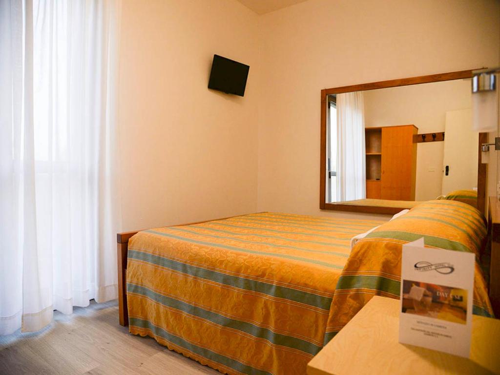 Postel nebo postele na pokoji v ubytování Infinity