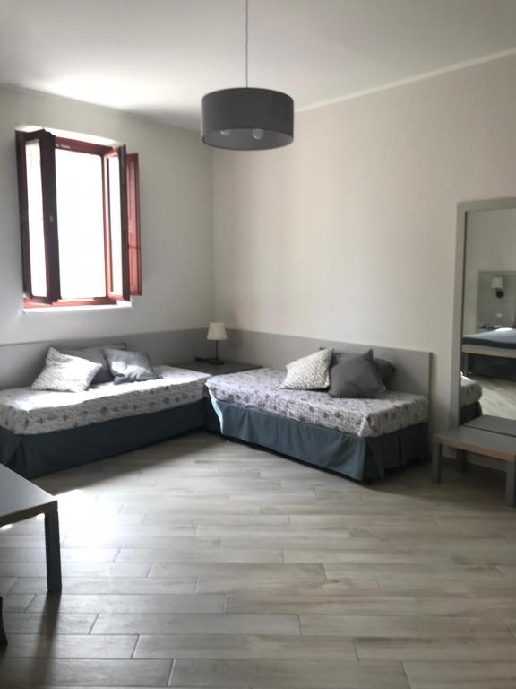 Postel nebo postele na pokoji v ubytování Sine Tempore B&B