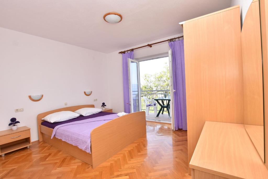 Postel nebo postele na pokoji v ubytování Apartment Angelina