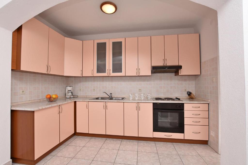 Kuchyň nebo kuchyňský kout v ubytování Apartment Angelina