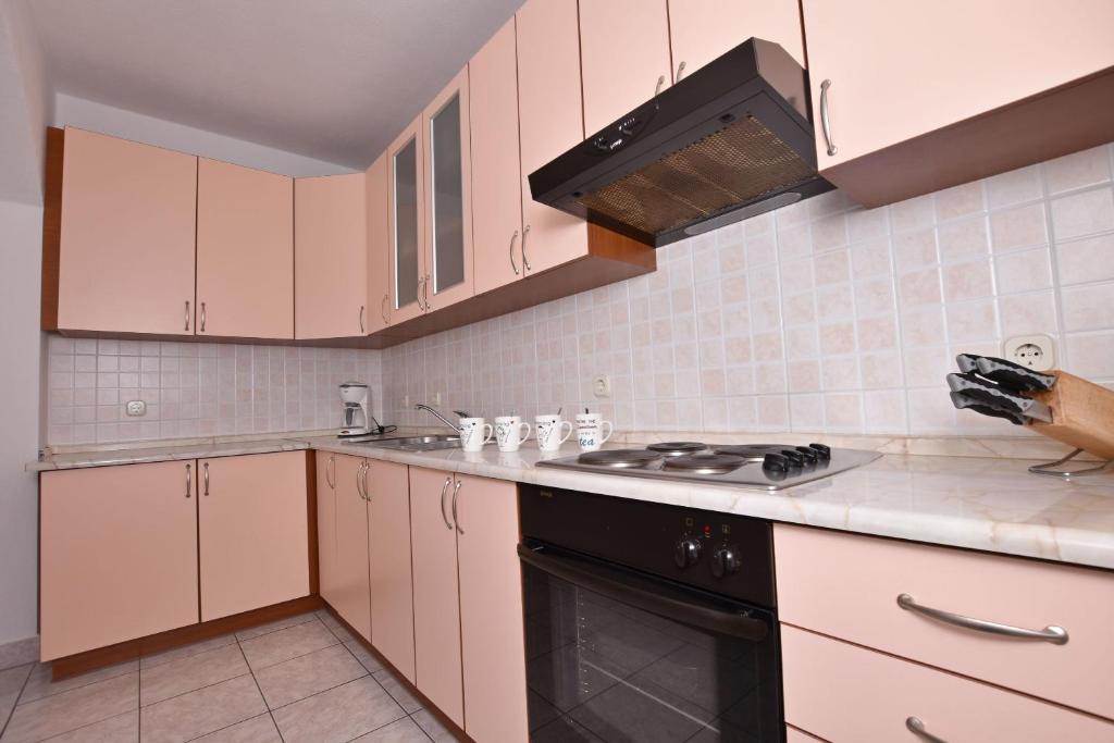 Kuchyň nebo kuchyňský kout v ubytování Apartment Angelina