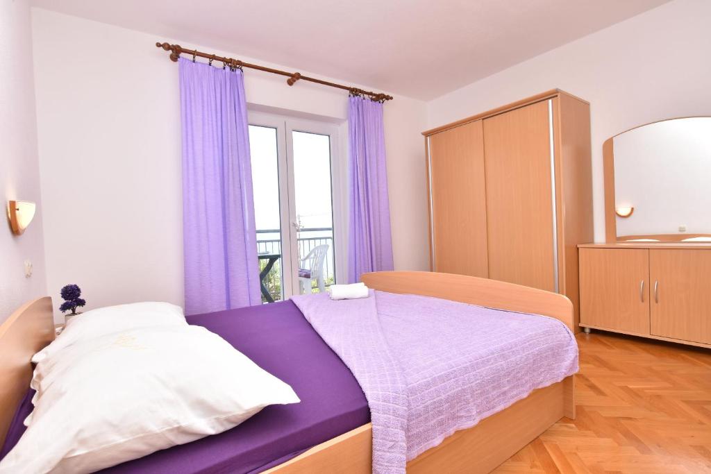 Postel nebo postele na pokoji v ubytování Apartment Angelina