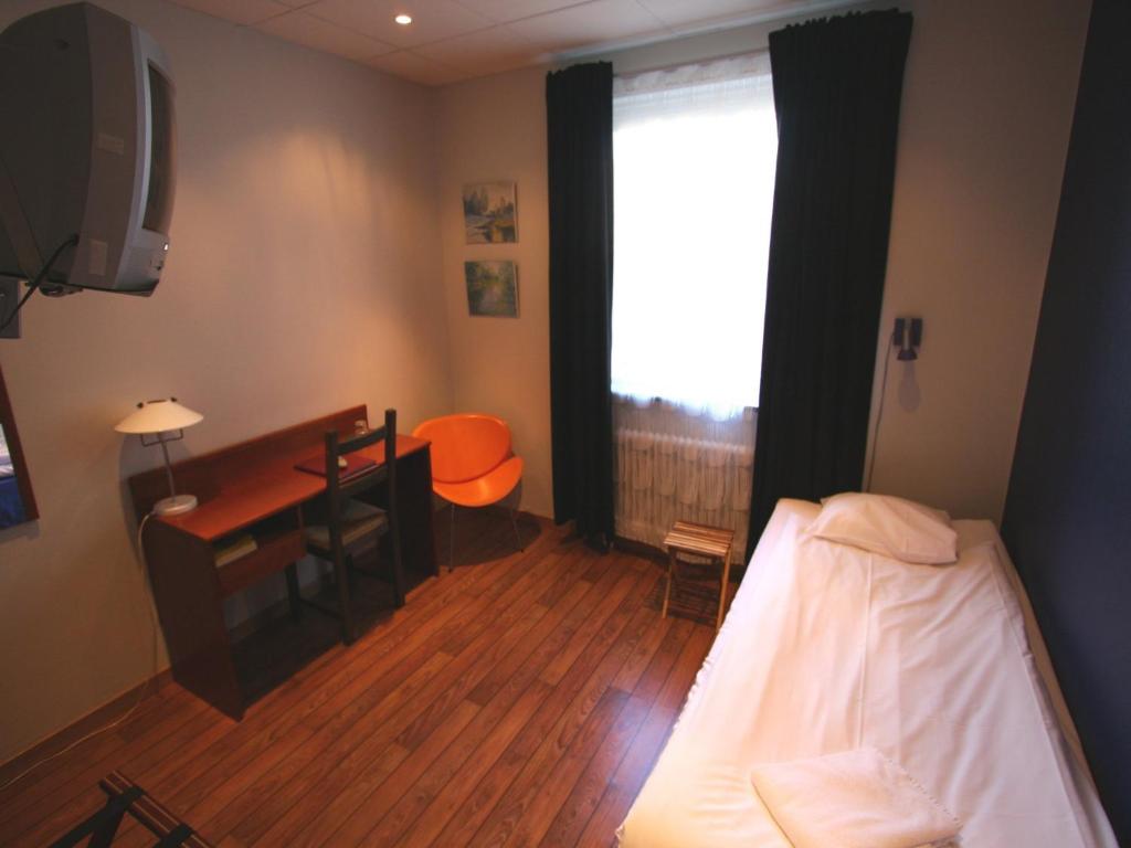 Postel nebo postele na pokoji v ubytování Hotell Linnéa