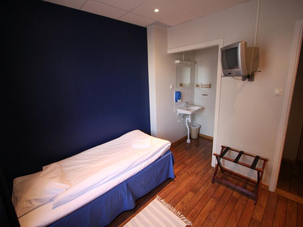 Postel nebo postele na pokoji v ubytování Hotell Linnéa