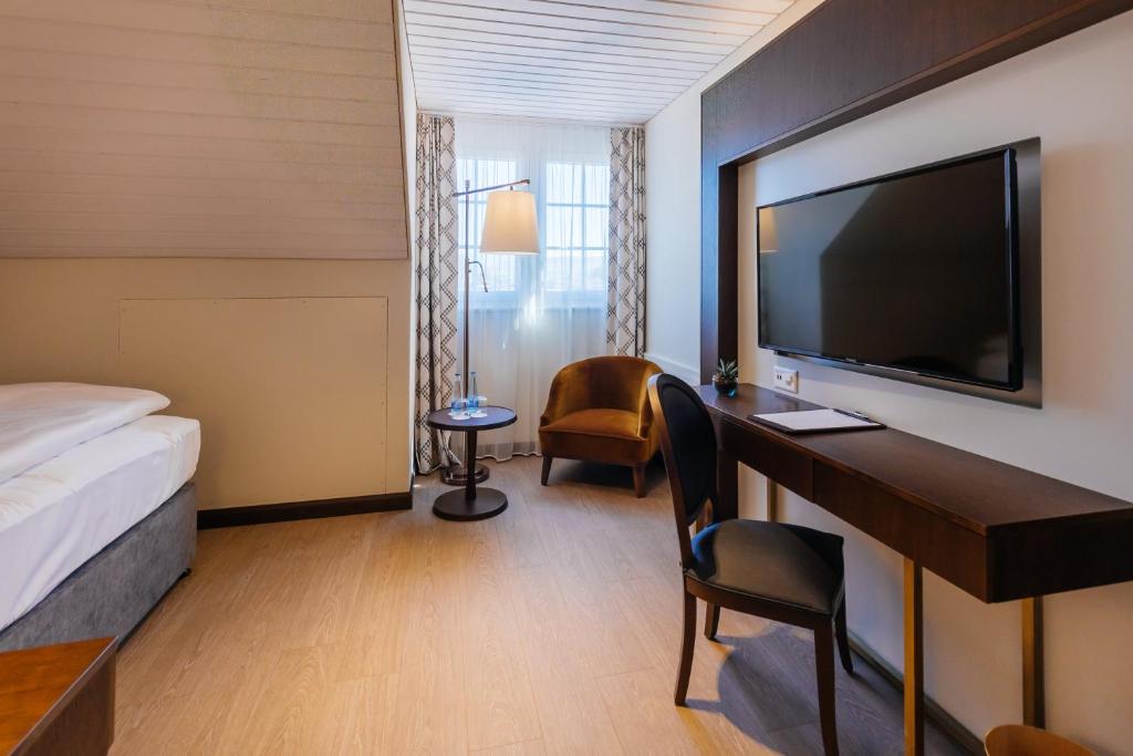 TV a/nebo společenská místnost v ubytování Hotel Taverna