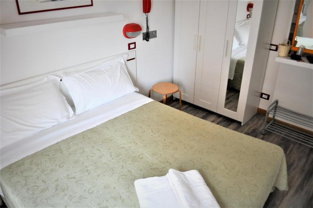 Postel nebo postele na pokoji v ubytování Hotel Corallo Garnì