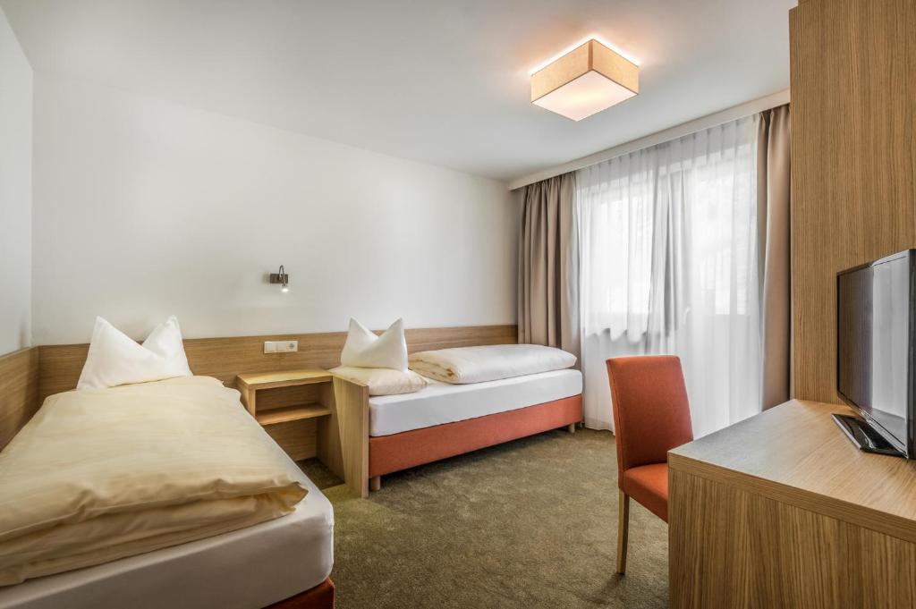 Letto o letti in una camera di Hotel Miramonti