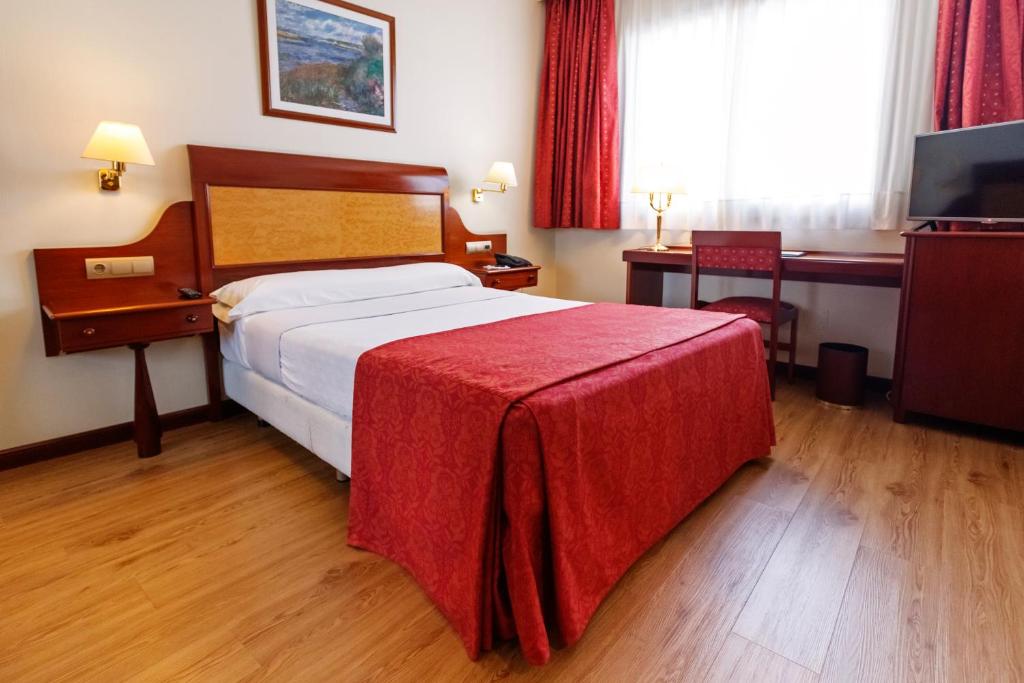 Posteľ alebo postele v izbe v ubytovaní Gran Hotel de Ferrol