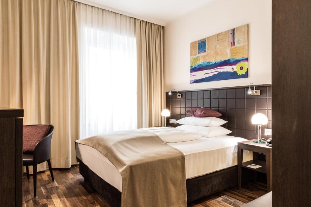 Krevet ili kreveti u jedinici u okviru objekta Hotel Sandwirth