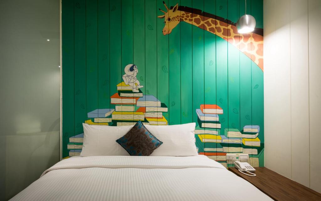 Postel nebo postele na pokoji v ubytování Merryday Hotel Banqiao