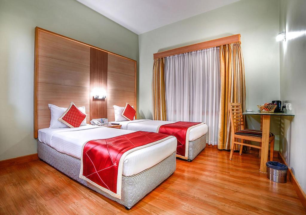 Postel nebo postele na pokoji v ubytování Ramoji Film City- Tara Comfort Hotel