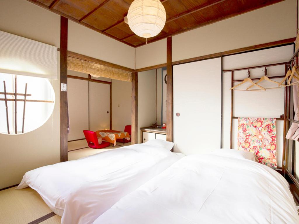Postel nebo postele na pokoji v ubytování Guest House Pongyi