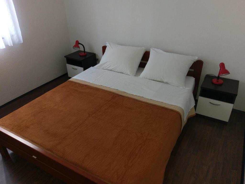 Postel nebo postele na pokoji v ubytování Apartments Ingrid