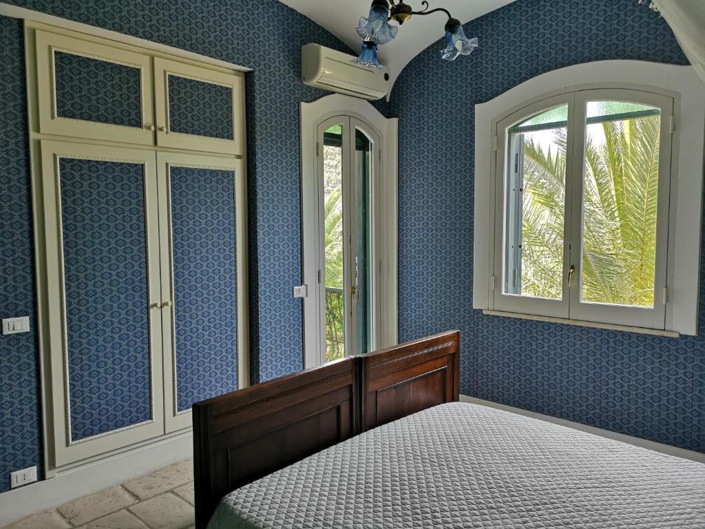 Postel nebo postele na pokoji v ubytování B&B La Salamandra Kitchengarden