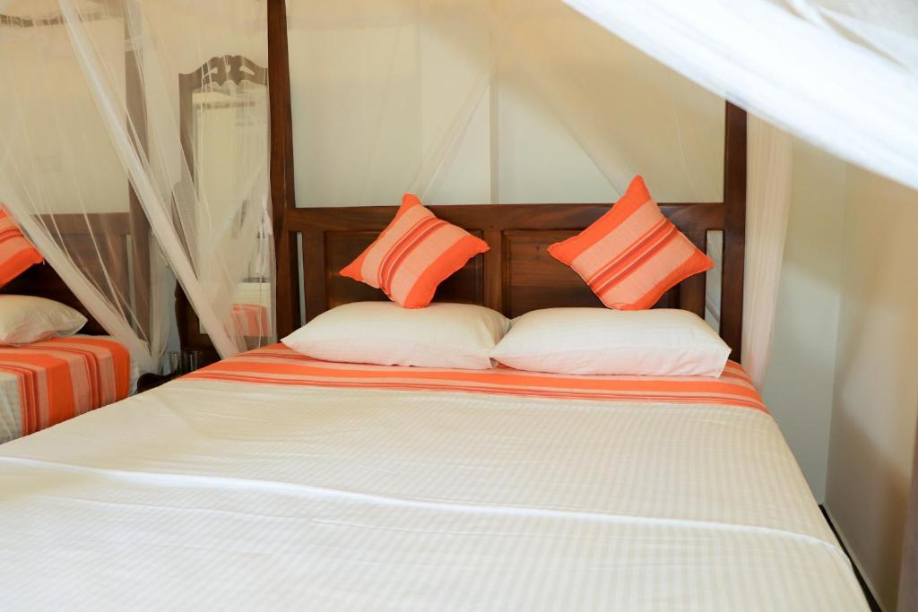 Postel nebo postele na pokoji v ubytování Welcome Inn Mirissa