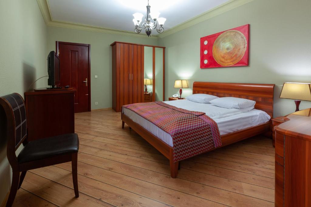 Postel nebo postele na pokoji v ubytování Penthouse Hotel