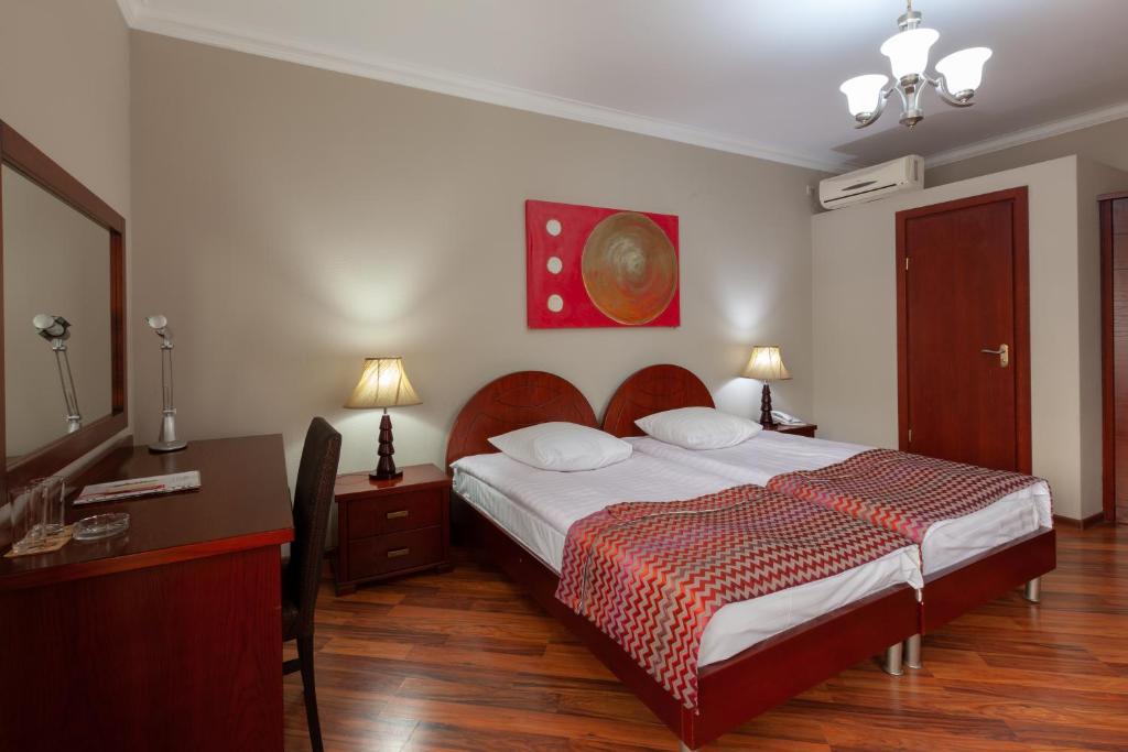 Postel nebo postele na pokoji v ubytování Penthouse Hotel