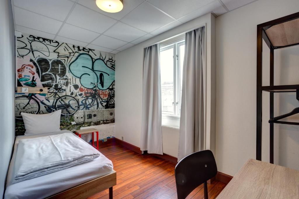 Postel nebo postele na pokoji v ubytování Urban House Copenhagen by MEININGER