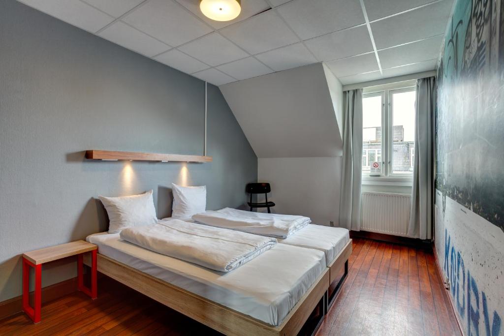 Postel nebo postele na pokoji v ubytování Urban House Copenhagen by MEININGER