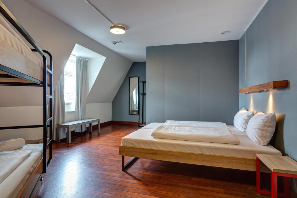 Postel nebo postele na pokoji v ubytování Urban House Copenhagen by MEININGER