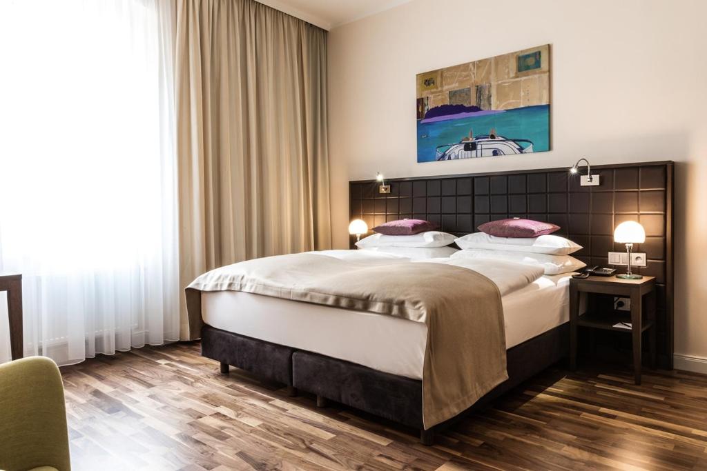 Krevet ili kreveti u jedinici u okviru objekta Hotel Sandwirth