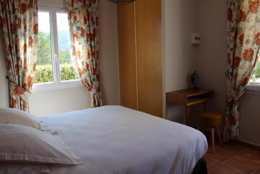 Postel nebo postele na pokoji v ubytování Bastide Saint Bernard