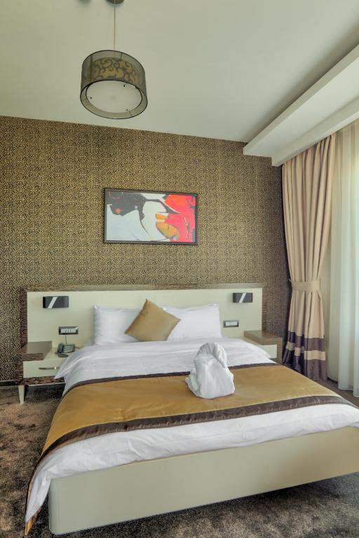 Postel nebo postele na pokoji v ubytování Amazona Hotel