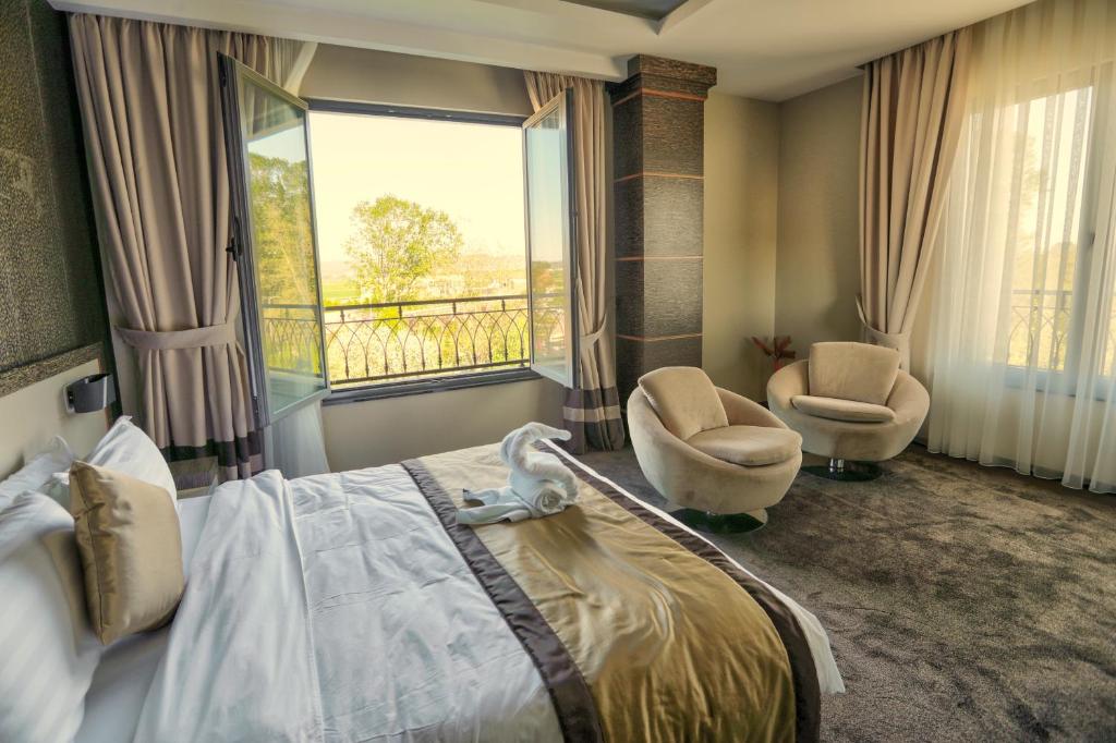 Postel nebo postele na pokoji v ubytování Amazona Hotel