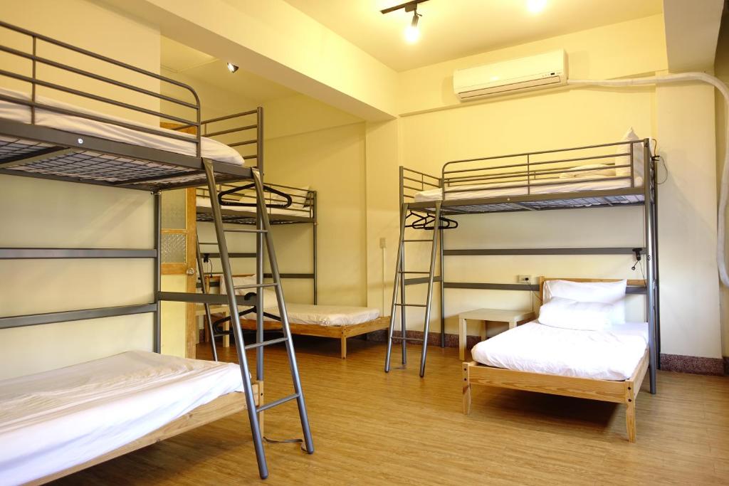 Postel nebo postele na pokoji v ubytování Chiayi Petite Hostel