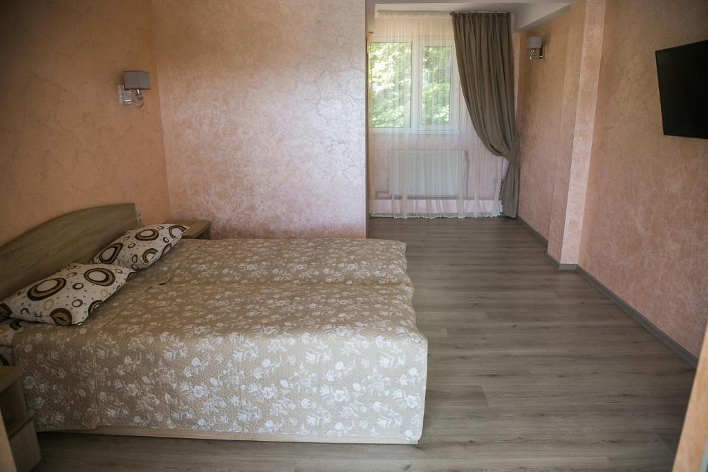 Postel nebo postele na pokoji v ubytování Arizona Hotel