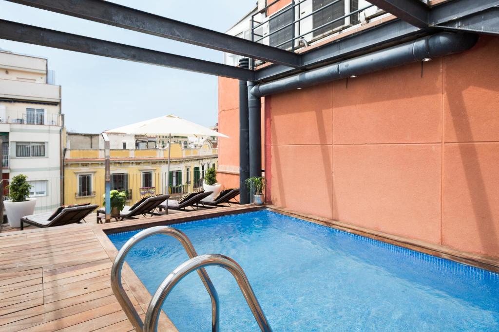 a swimming pool on the roof of a building at My Space Barcelona Pool City Center in Barcelona