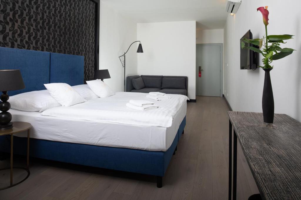 Postel nebo postele na pokoji v ubytování Antik Hotel Prague