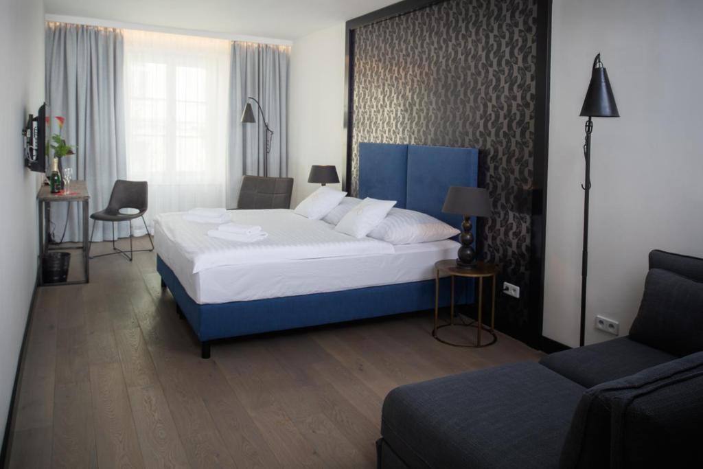 Postel nebo postele na pokoji v ubytování Antik Hotel Prague