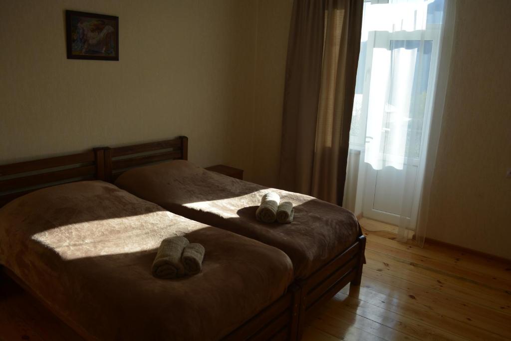 Postel nebo postele na pokoji v ubytování Ekaterine Guest House