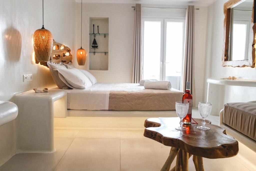 Postel nebo postele na pokoji v ubytování Villa Elina suites and more