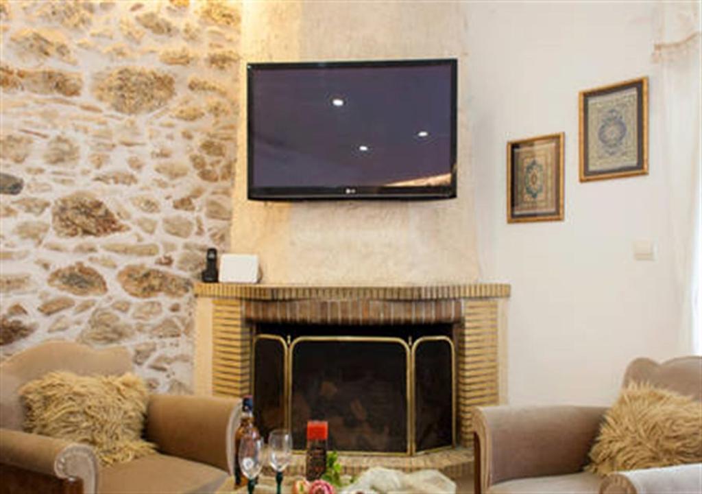 Televízia a/alebo spoločenská miestnosť v ubytovaní Papyrus City Centre Apartments