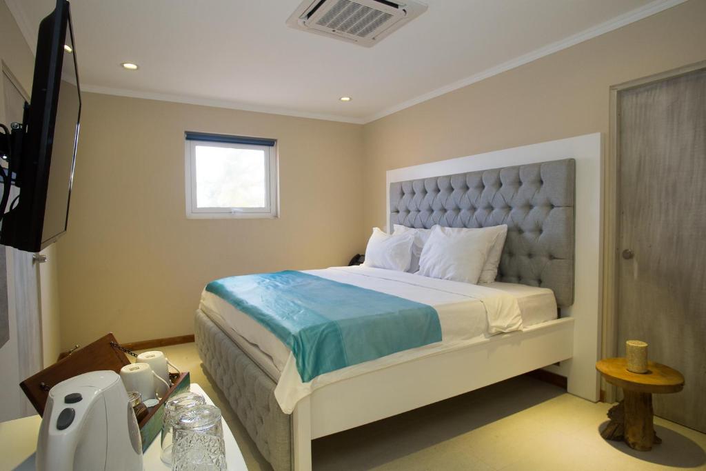 Postel nebo postele na pokoji v ubytování Hotel Islander Bonaire