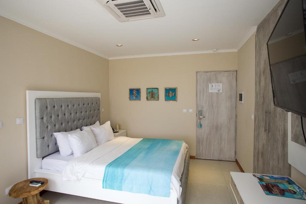 Postel nebo postele na pokoji v ubytování Hotel Islander Bonaire