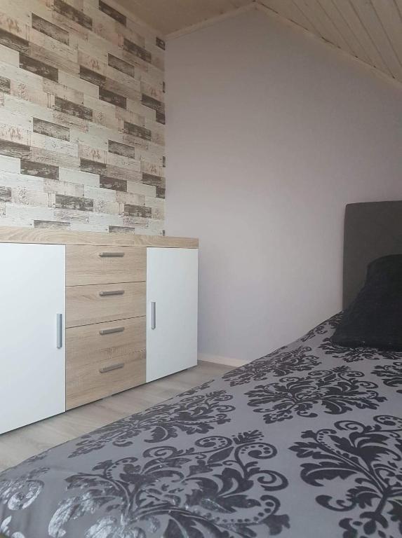 Postel nebo postele na pokoji v ubytování Słoneczna Polana