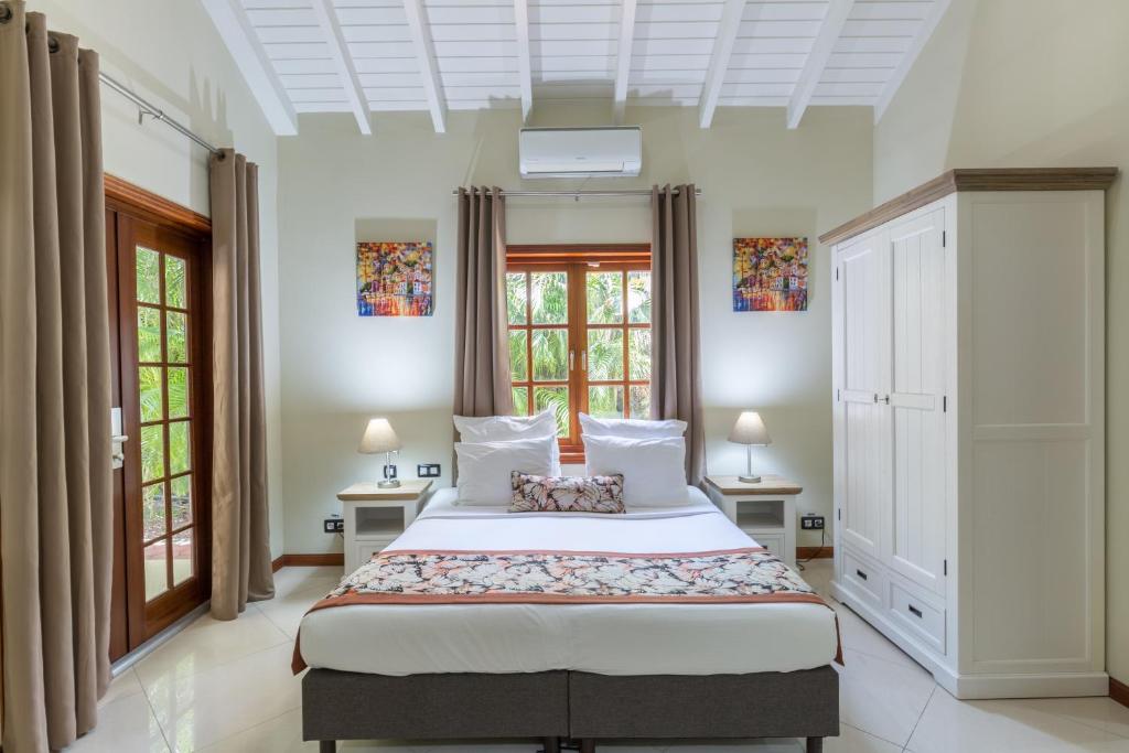 Postel nebo postele na pokoji v ubytování Acoya Curacao Resort, Villas & Spa