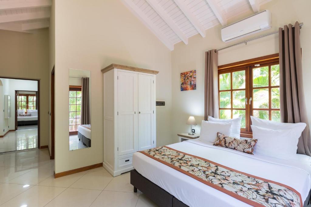 Postel nebo postele na pokoji v ubytování Acoya Curacao Resort, Villas & Spa