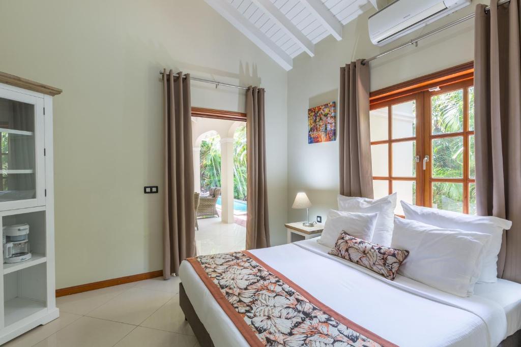 Postel nebo postele na pokoji v ubytování Acoya Curacao Resort, Villas & Spa