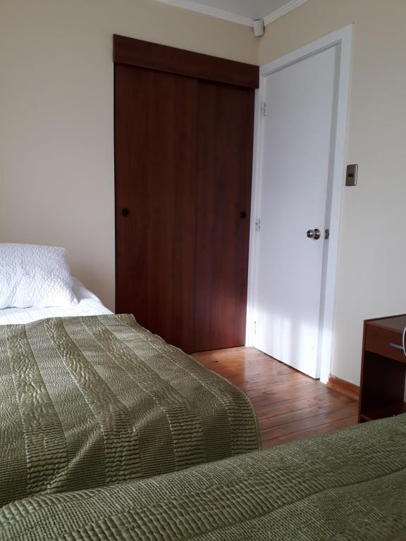 Postel nebo postele na pokoji v ubytování Cabañas Lago Azul