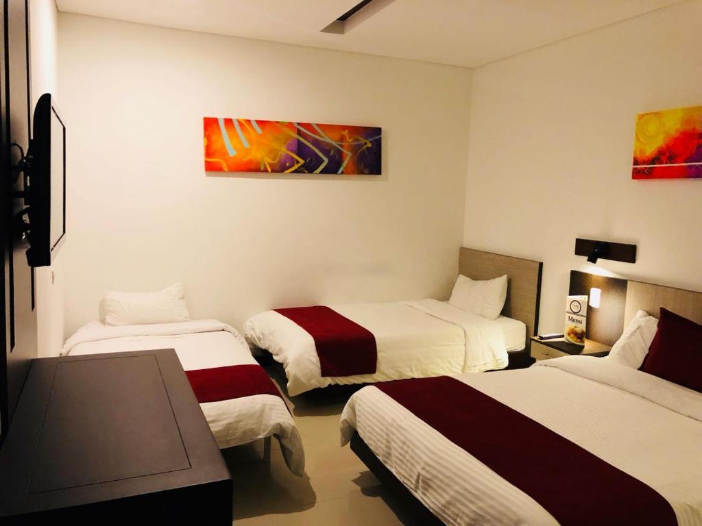 Postel nebo postele na pokoji v ubytování Hotel Toscana Oriente
