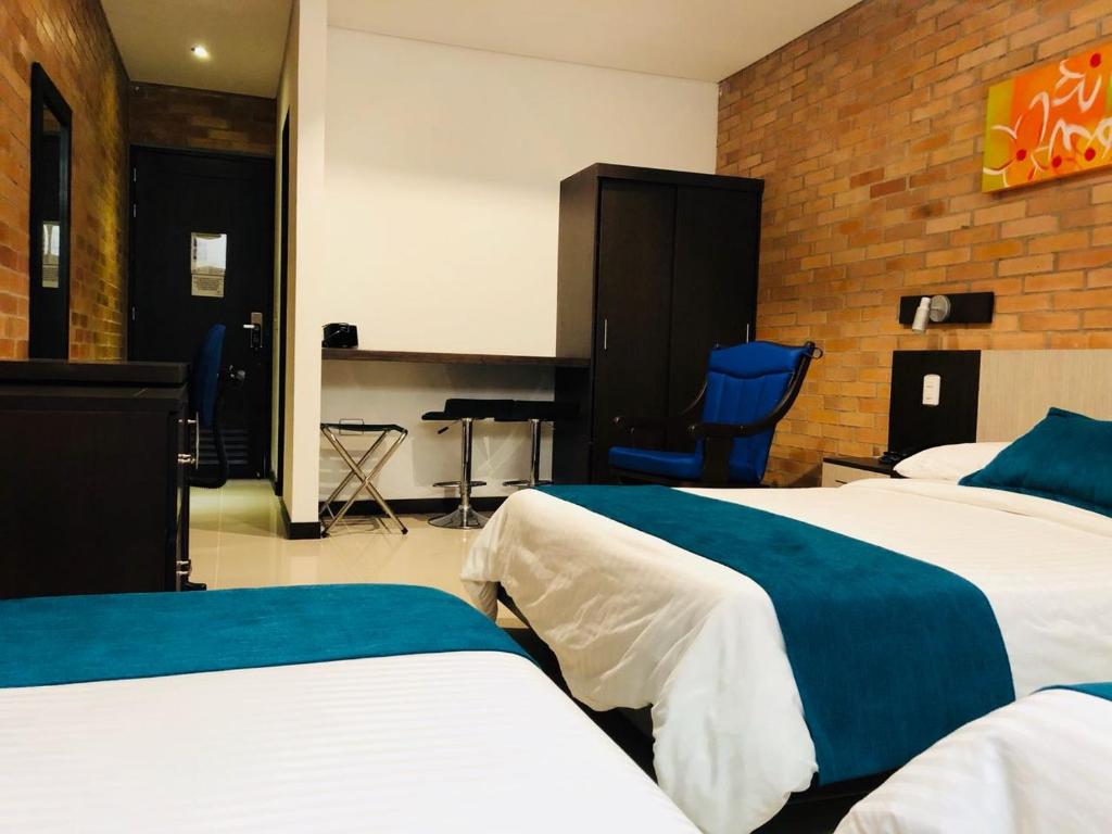 Postel nebo postele na pokoji v ubytování Hotel Toscana Oriente