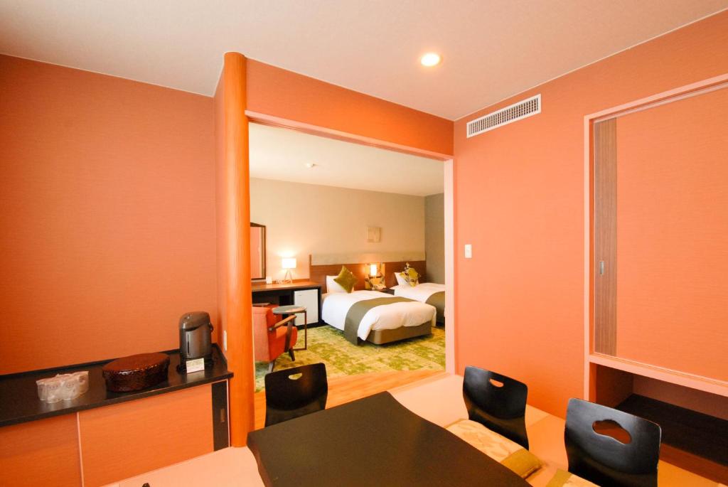 Postel nebo postele na pokoji v ubytování Hakuba Mominoki Hotel