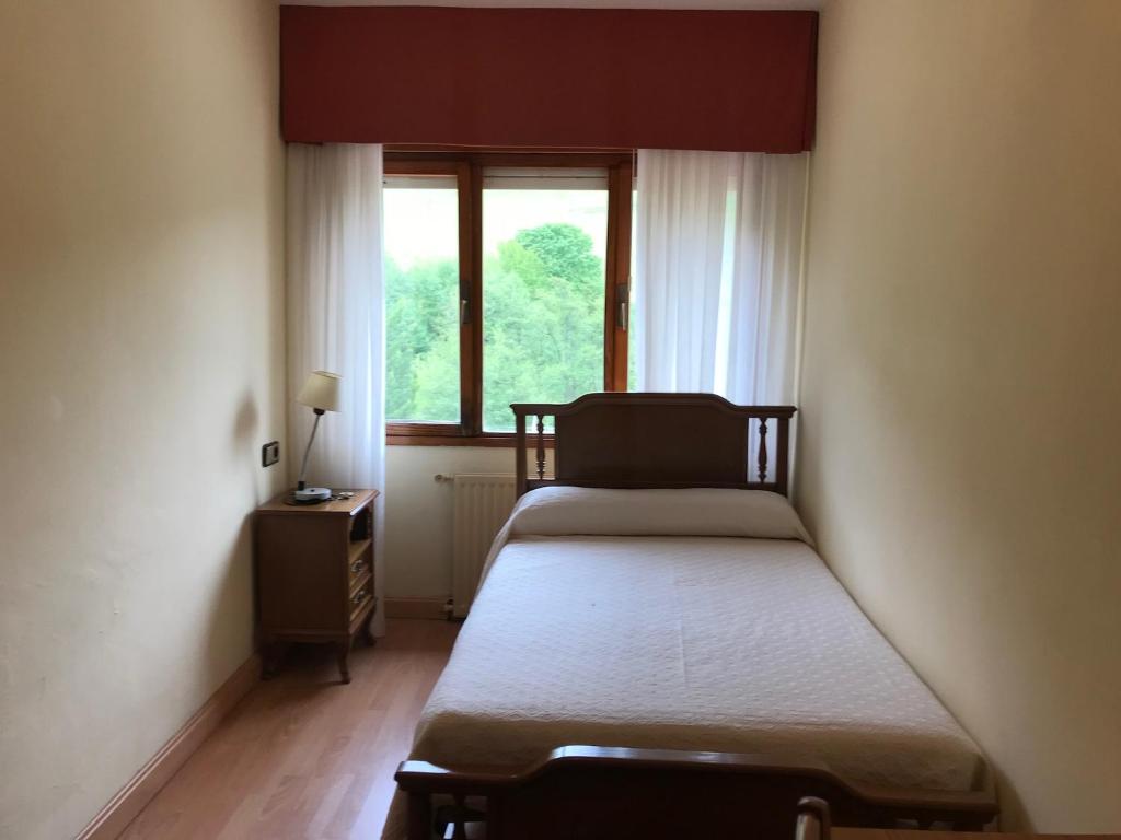 Postel nebo postele na pokoji v ubytování Hotel Peñagrande