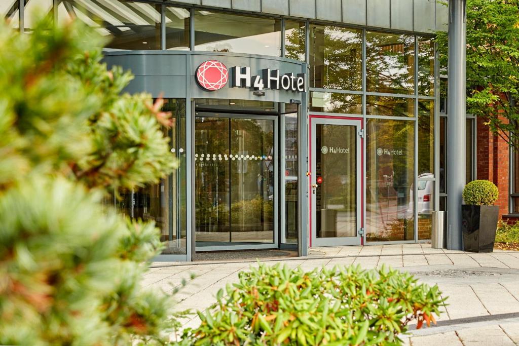 a building with a halo sign in front of it at H4 Hotel Hannover Messe in Hannover